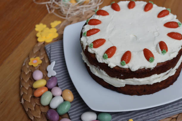 istock Carrot cake with mascarpone cream cheese and carrot decorations with Easter eggs and decorations 2198314323