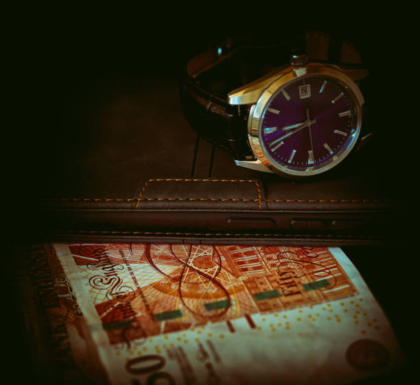 Japanese mechanical watch lies on a black background