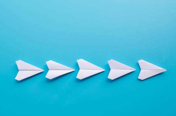 istock Top view of origami white paper airplanes with customizable space for text 2198317032
