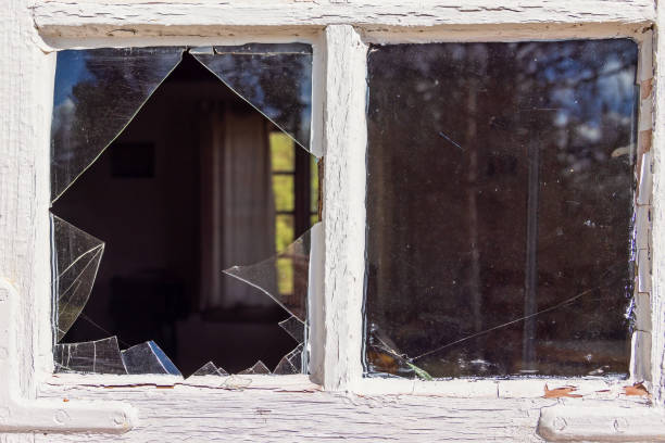 istock Close up at a window with broken glass on a cottage 2198317047