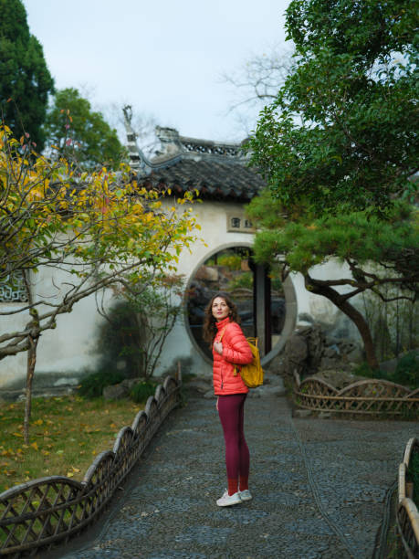 istock Woman exploring classical Chinese garden in Suzhou, China 2198320899