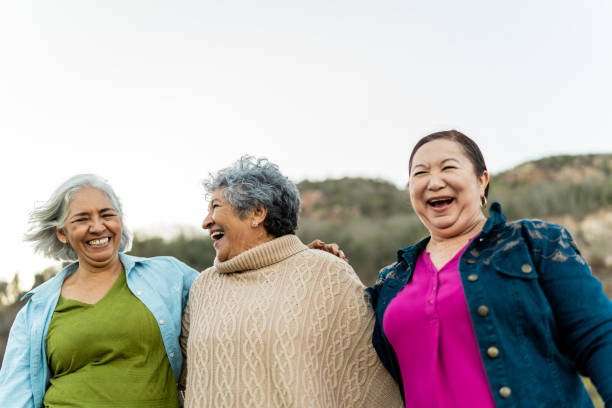 istock Senior friends walking and talking outdoors 2198322264