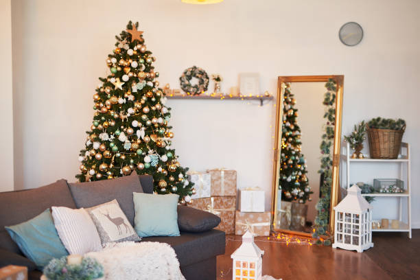 istock Interior light kitchen with christmas decor and tree. Turquoise-colored kitchen in classic style. Christmas in the kitchen. Bright kitchen in mint and white shades with Christmas. 2198324665