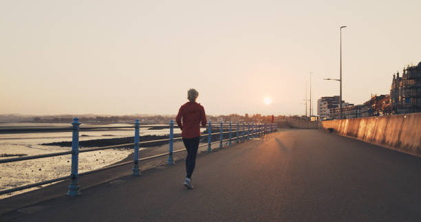 istock Early morning jog, Morecambe Bay, England 2198325281