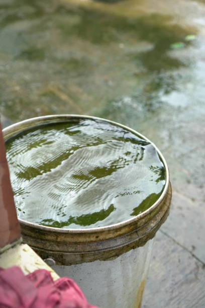 istock Focus on the water-filled bucket and its rippling surface 2198325674