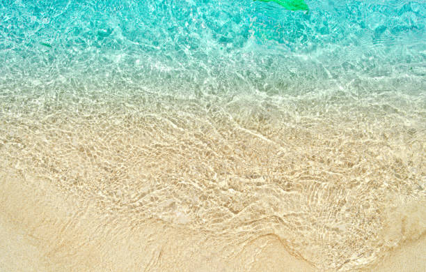 wave on sand beach, close up, top view