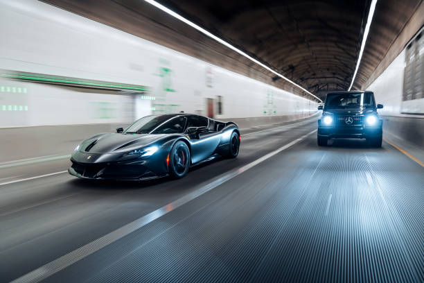 Seattle, WA, USAFebruary 7, 2025Ferrari SF90 Stradale and G Wagon driving in a tunnel showing the front of the cars