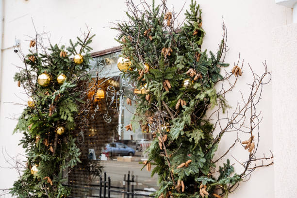 istock A stunningly beautiful Christmas wreath is elegantly hung on a charming building, significantly enhancing its festive appearance during the joyful and joyous holiday season we all cherish 2198332420