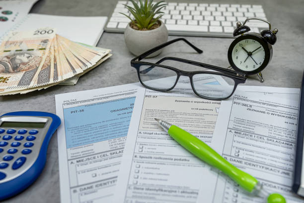 istock Polski empty tax forms pit 36 37 38 with pen calculator glasses. Information on revenues 2198332906