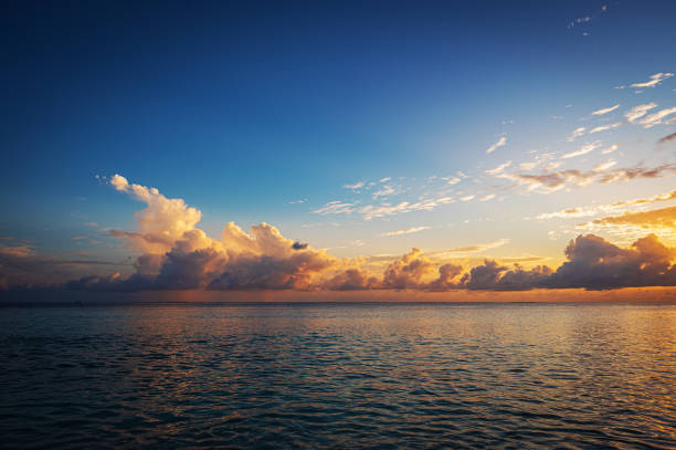 istock Tropical ocean with dramatic sky and colorful clouds during the sunset 2198334556