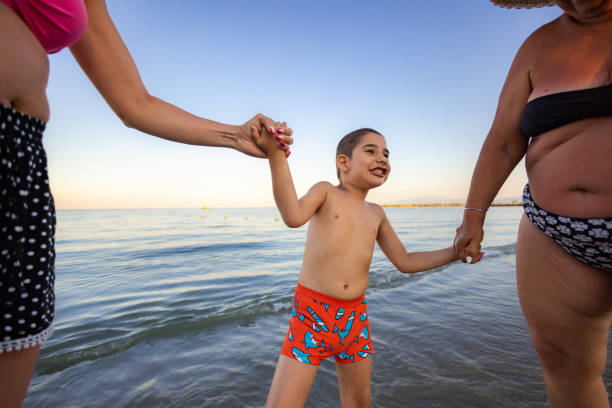 istock Seaside Serenity With Family 2198335146