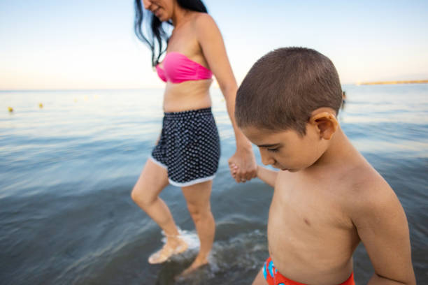 Mother and Son Strolling by the Sea