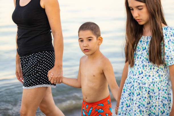 istock Seaside Family Walk 2198336725