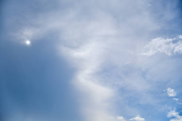 istock Cloudscape with clouds covering the sun under the blue sky. 2198339097