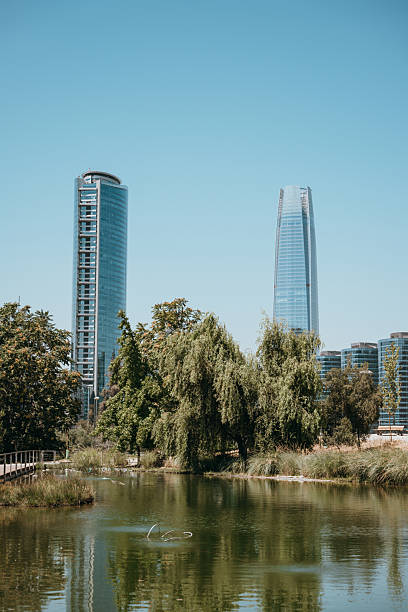 istock Modern Skyscrapers Reflecting in a Tranquil Urban Park 2198340912