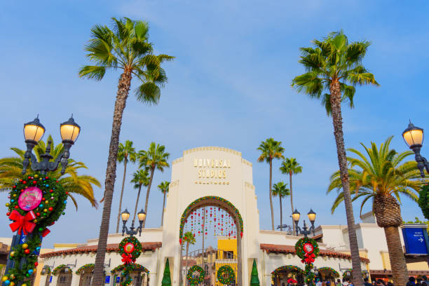 Los Angeles, California - December 24, 2024: Vibrant entrance archway with festive wreaths and palm trees