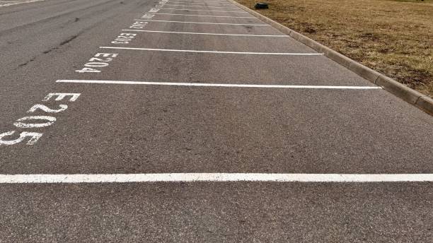 istock The empty parking lot features clearly marked designated parking spaces E204 and E205 2198342498