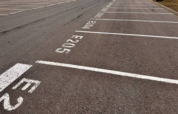 istock The empty parking lot features clearly marked designated parking spaces E204 and E205 2198343311