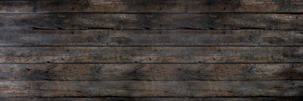 istock Textured Dark Wood Planks Background for Various Design Projects and Creative Uses 2198343671