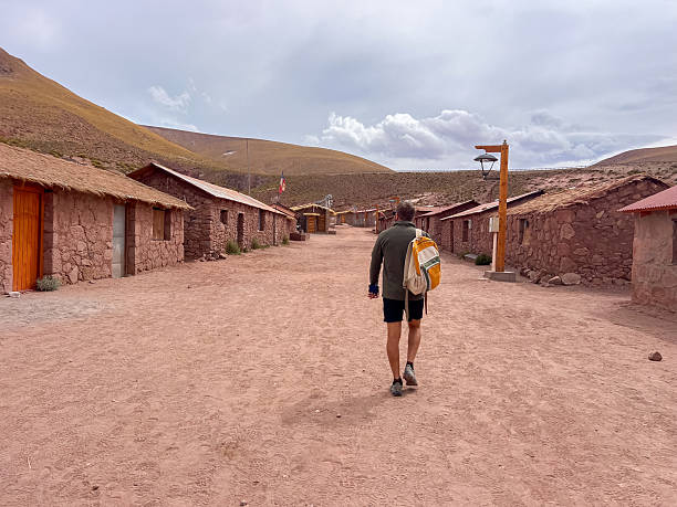istock Traveler Walking Through Rustic Atacama Desert Village 2198344339