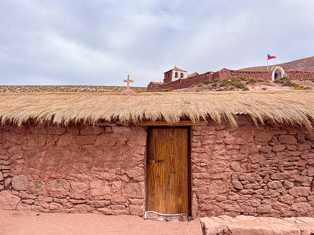 istock Rustic Adobe Building with Straw Roof in Desert Landscape 2198344598