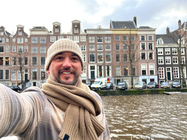 istock Tourist taking selfie in Amsterdam during Christmas holidays 2198347067