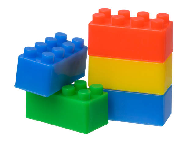 Multi-colored plastic cubes of a children's designer on a white isolated background, stack