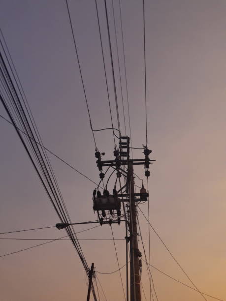 istock low angle view of electric pole under the sunset sky 2198347458
