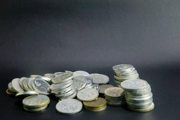 istock Stack of Currency Coins, savings on black Background 2198351364