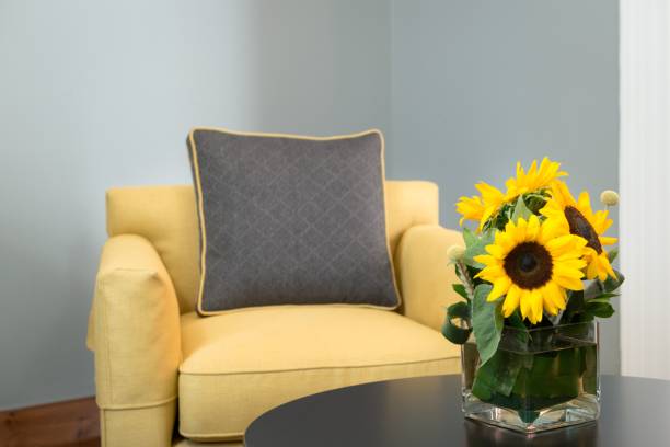 istock Cozy interior with armchair and sunflowers. 2198353649