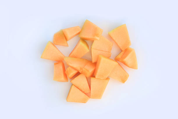Piece Sliced cantaloupe melon isolated on white background. Top view