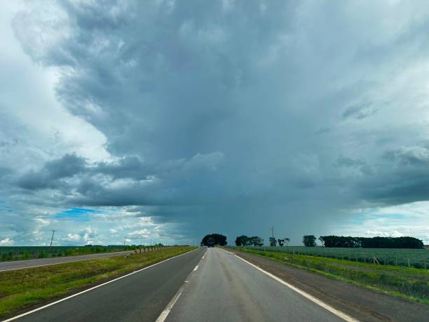 istock Beautifull rain cloud on road horizon 2198354998