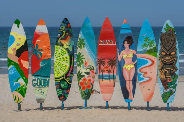 Colorful surfboards in the sand at My Khe Beach, the most popular beach along the Da Nang Waterfront on May 16, 2023 in Da Nang, Vietnam