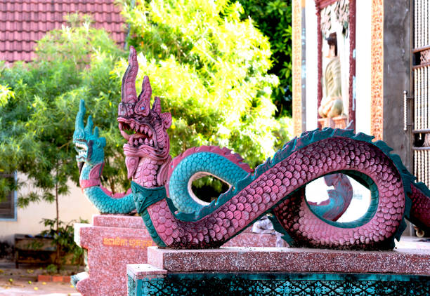 Shot in color detail on the facade of this historic building representing some character, animal or flower. Set at Siem Riep, Angkor Wat , Cambodia, Asia