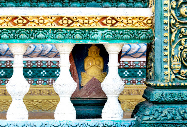 Shot in color detail on the facade of this historic building representing some character, animal or flower. Set at Siem Riep, Angkor Wat , Cambodia, Asia