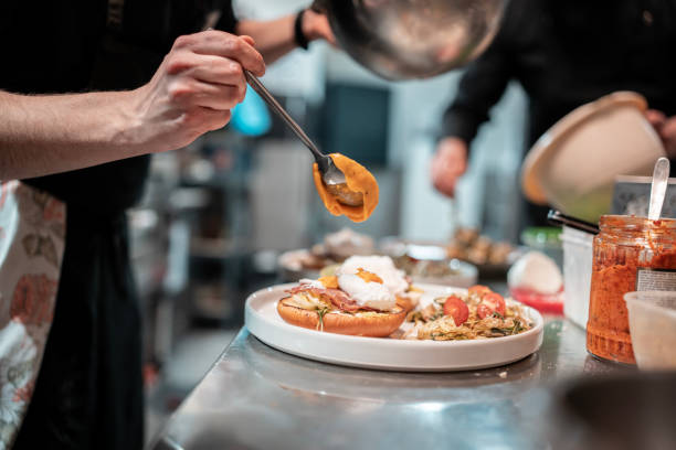 istock The chef puts the sauce on the house specialty 2198355478