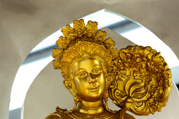 istock smiling lady next to the big golden flower 2198355821