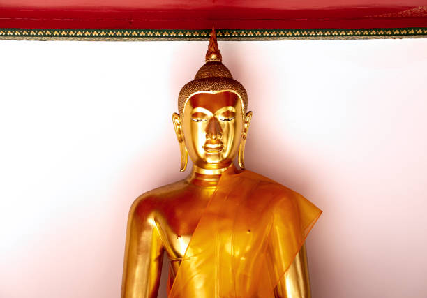 Shot in color detail on the facade of this historic building representing some character, animal or flower. Inside a buddhist temple in the city of bangkok. Set at Bangkok, Thailand, Asia