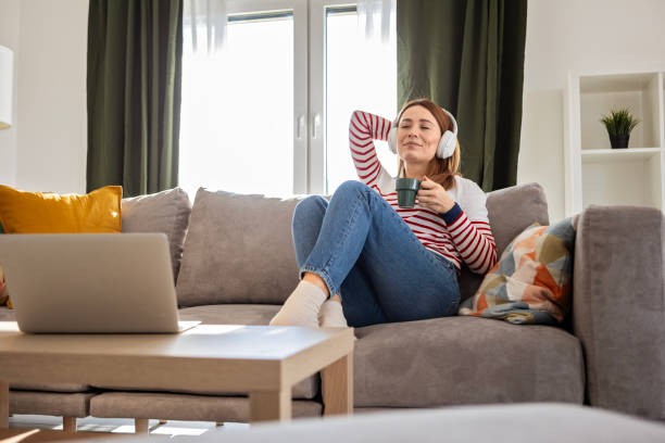 istock Woman Enjoying Her Favorite Tunes 2198360922