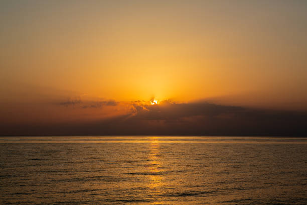 istock Sunrise over sea with glowing sky. 2198361221