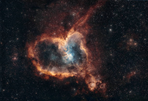 The Heart Nebula deep space astrophotography, a majestic cosmic scene in orange and blue tones