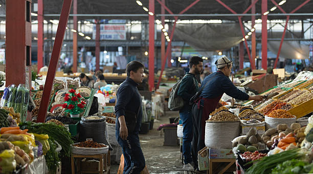 Bishkek, Kyrgyzstan October 11 2024:  hawker sell the nuts and dried fruit in Osh Bazaar. Osh Bazaar is one of biggest bazaar in Kyrgyzstan.