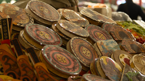 Bishkek, Kyrgyzstan October 11 2024:  the folk container with dried nut which is  the souvenir for tourists in Osh Bazaar. Osh Bazaar is one of biggest bazaar in Kyrgyzstan.