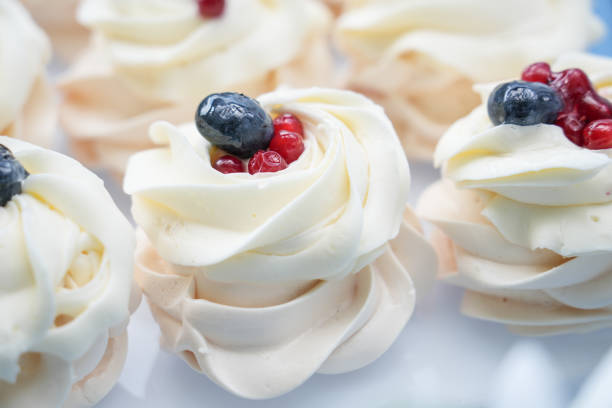 Colorful Meringue Desserts on Display in a Pastry Shop Window