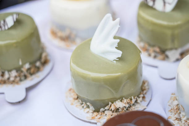 Well decorated small cake with pistachio on table