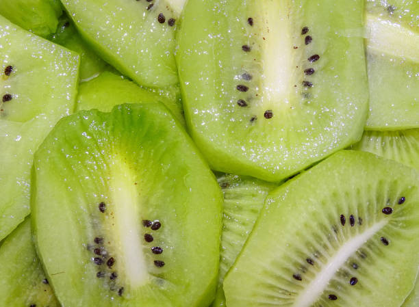Background with kiwi slices. Fresh kiwi