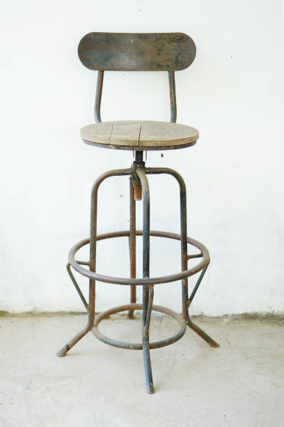 istock Rustic Metal Bar Stool With Wooden Seat in Minimalist Setting 2198370513