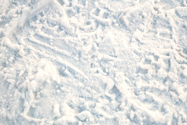 Human traces in the snow in winter. Footprints.