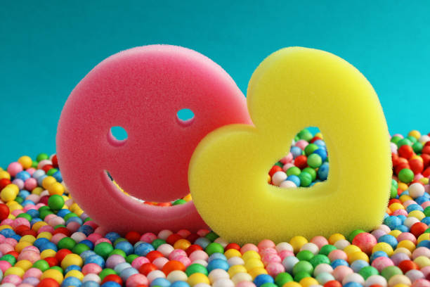 Openwork heart and happiness face surrounded by colorful spheres