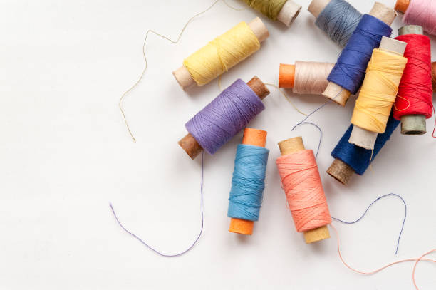 istock Reels of colorful threads on a white 2198375261